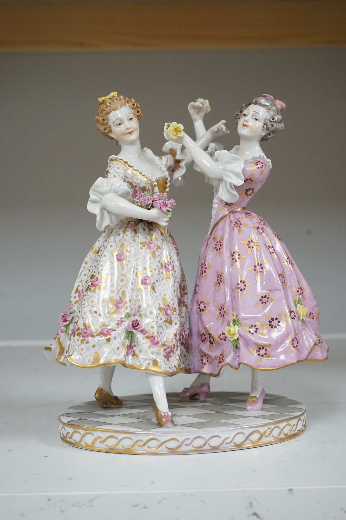 A Continental porcelain group of two dancers, 20cm high